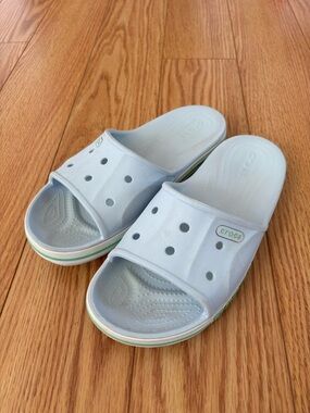 CROCS women’s Light Blue Slide Sandals with Green Trim